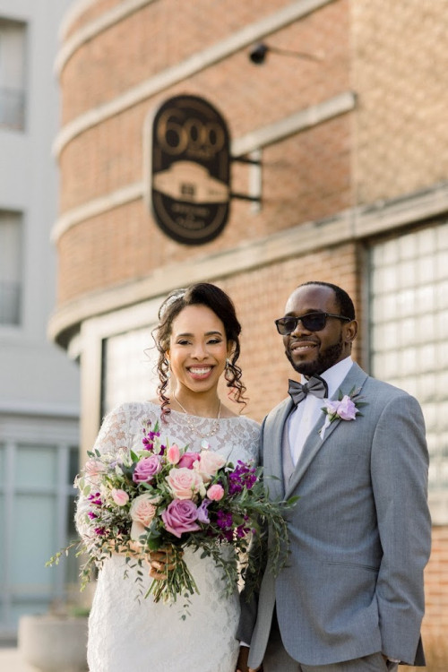 Bride and groom outside 600 East Events