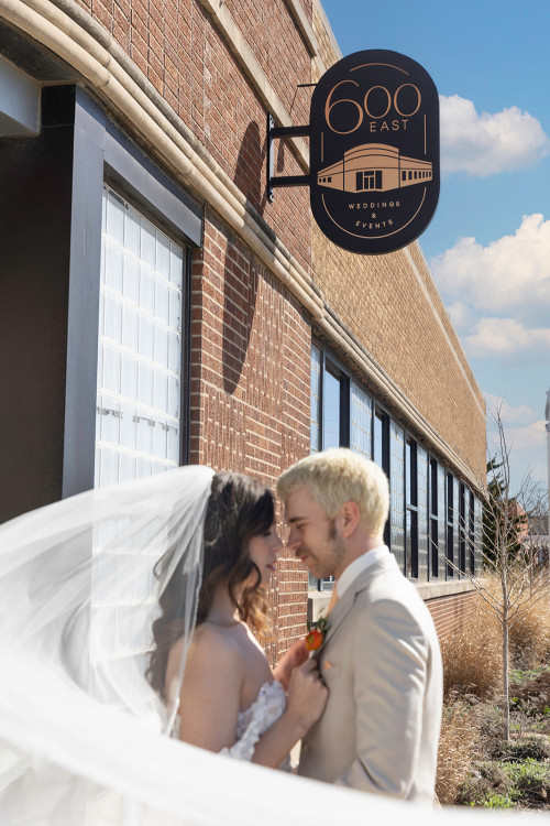 Bride and groom outside 600 East Events