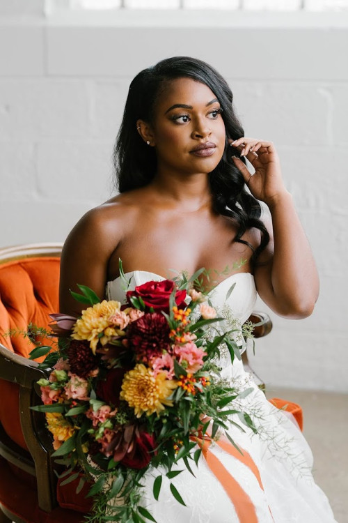 Bride holding flowers inside 600 East Events