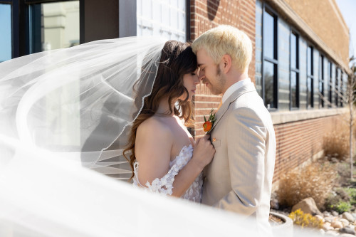 Bride and groom outside 600 East Events