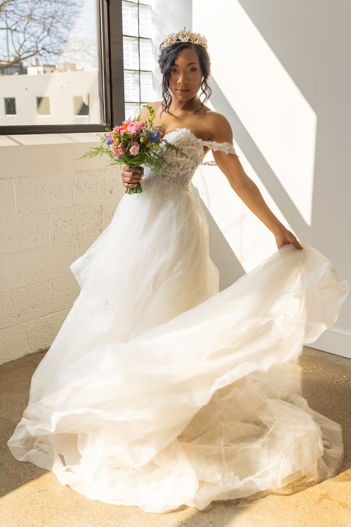 Bride holding flowers inside 600 East Events